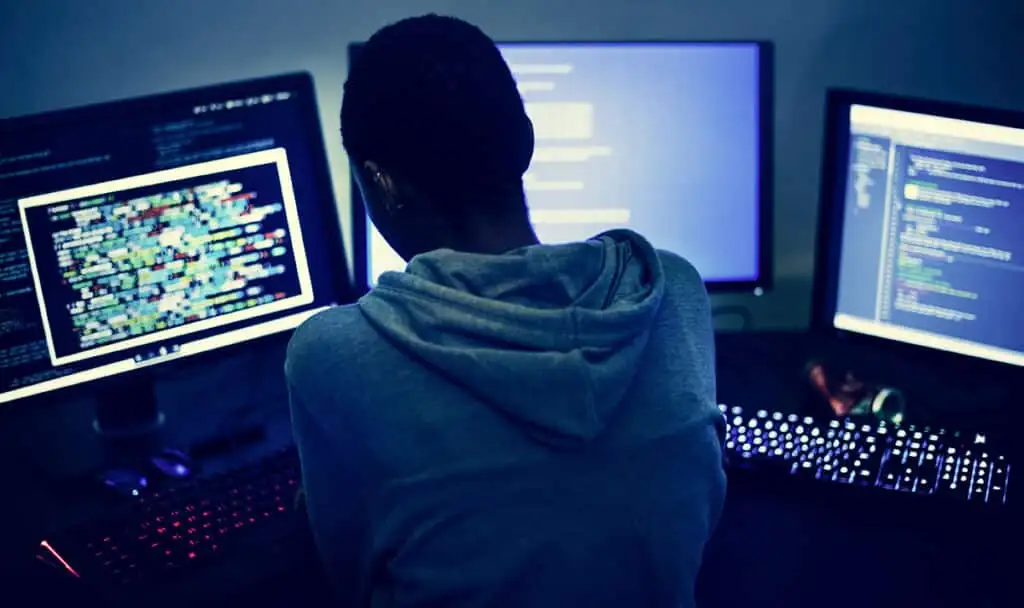 programmer working on computers programmer-working-on-computers