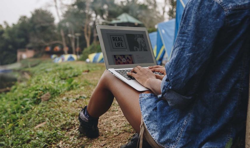 woman-alone-in-nature-using-a-laptop-Introverted-computer-programmer