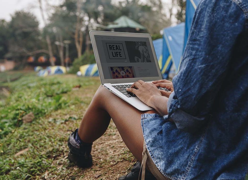 woman-alone-in-nature-using-a-laptop-Introverted-computer-programmer