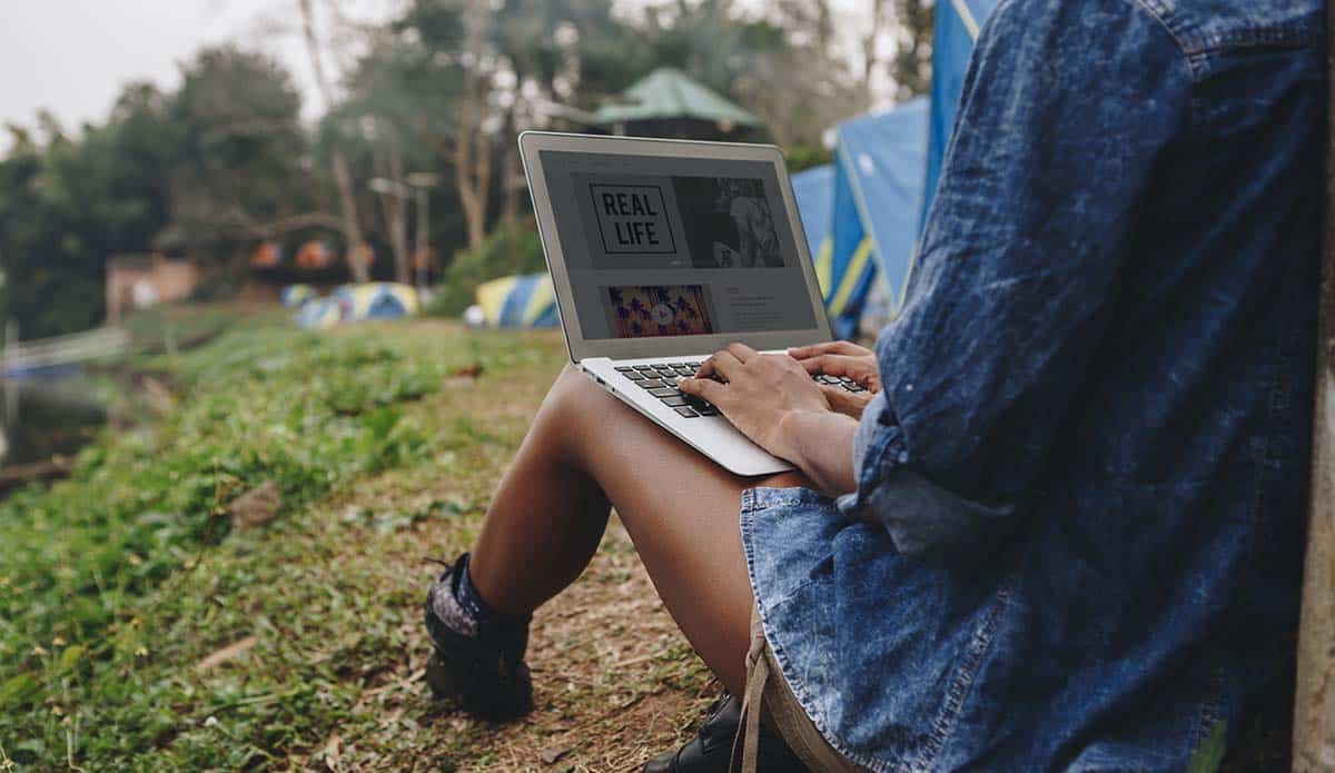 woman-alone-in-nature-using-a-laptop-Introverted-computer-programmer