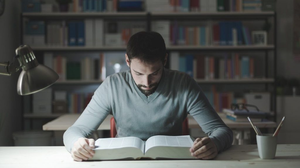smart-man-studying-at-night