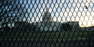 the capitol building behind a fence