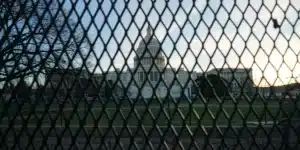 the capitol building behind a fence