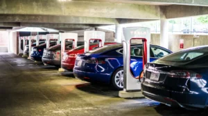 tesla electric cars parked charging station