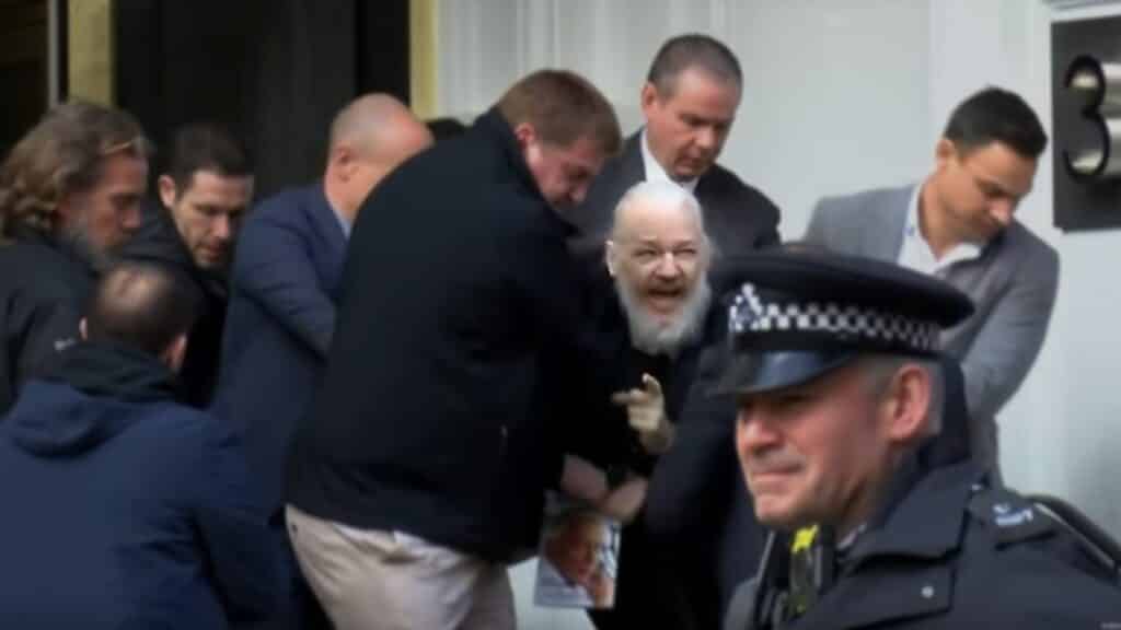 Julian Assange being removed from the Ecuadorian embassy. th A Julian Assange being removed from the Ecuadorian embassy.